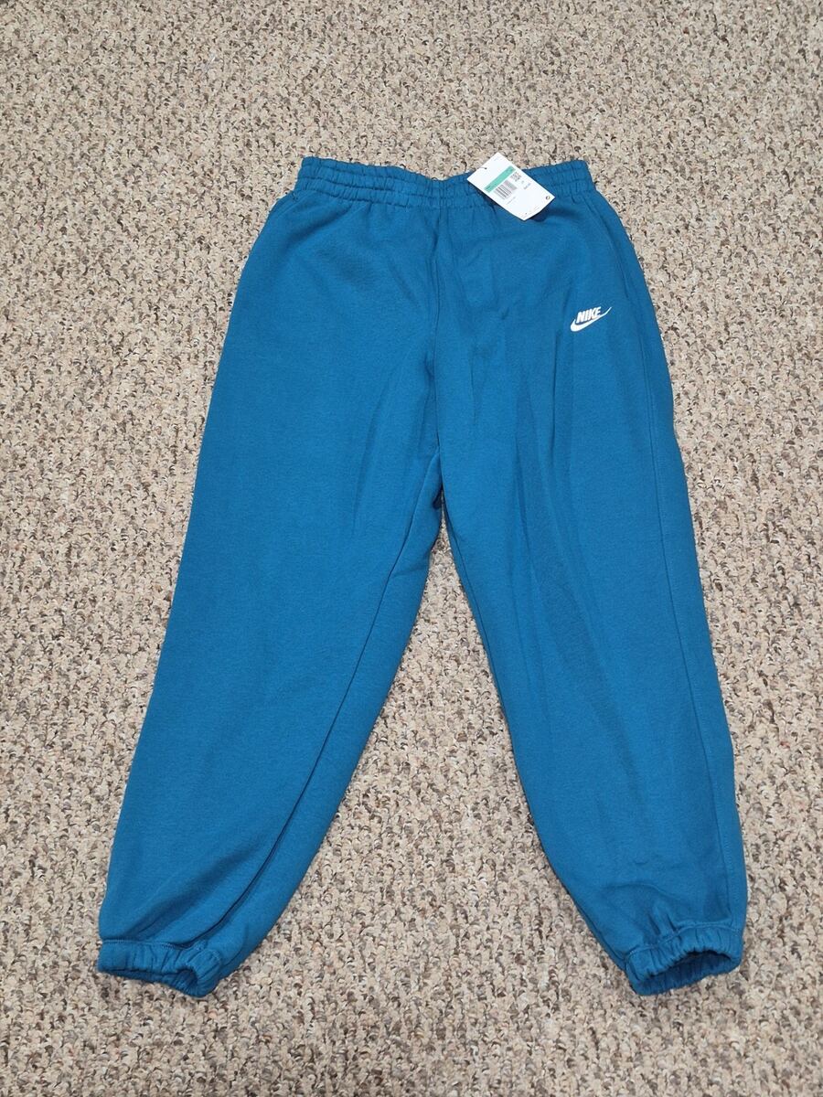 Kids XL Loose Fit teal blue Nike Sportswear Club Fleece sweatpants with an